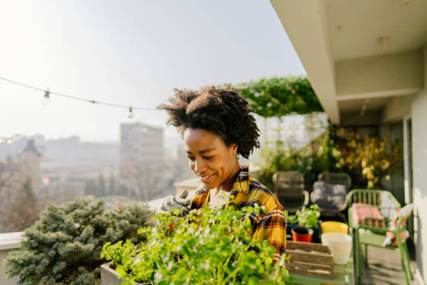 istock Rearranging my balcony garden 1306572150