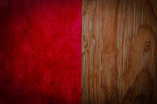 Brown aged wooden texture of the wall outdoors with red painted wall. . Abstract material background