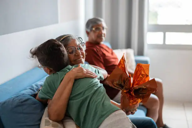 Photo of Boy hugging his grandmother at Easter