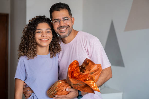istock Father and daughter celebrating Easter at home 1306575427