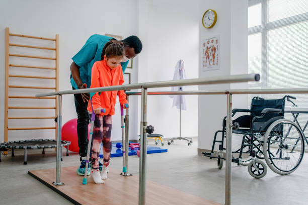 istock Young patient doing physiotherapy at a clinic with help of a therapist 1306575493