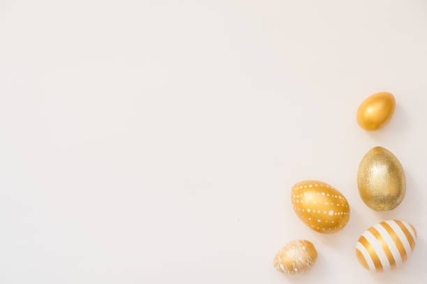 istock Frame of Easter decorated eggs isolated on white background. Minimal easter concept. Happy Easter card with copy space for text. Top view, flatlay 1306575499