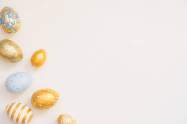 istock Frame of Easter decorated eggs isolated on white background. Minimal easter concept. Happy Easter card with copy space for text. Top view, flatlay 1306575510