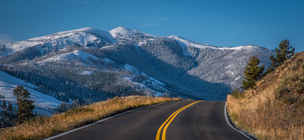 istock Highway toward Mount Washburn after September snow in Yellowstone 1306580415
