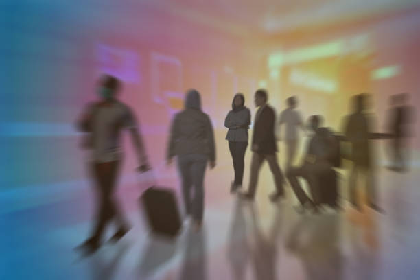 istock Composite image of people walking in blur motion, fast motion business 1306602297