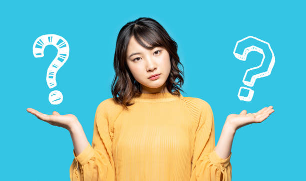 istock Young woman comparing with two things. 1306611139