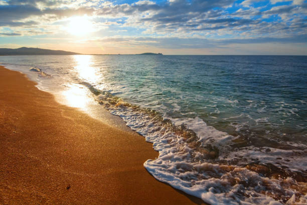 istock sunrise over a sea beach 1306612102