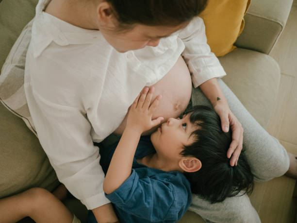 istock Pregnant mother and child. 1306612891