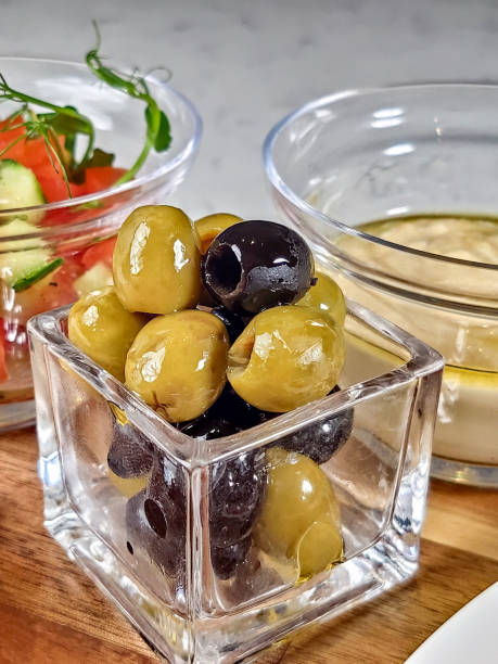 olives in a closeup bowl on the table in a restaurant