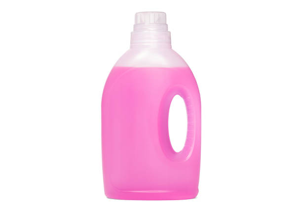 istock Detergent bottle, pink liquid washing soap for textile, isolated on white 1306616525