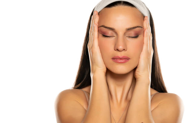 istock young woman tightening her face with her hands 1306618312