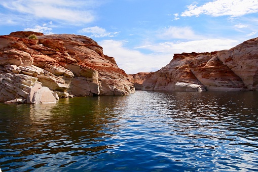 View of narrow cliff canyon from a boat in Glen Canyon National Recreation Area, Lake Powell, Arizona