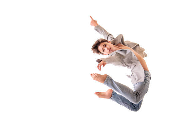 istock Ballet dancer teen boy jumping on white background, isolate 1306620721