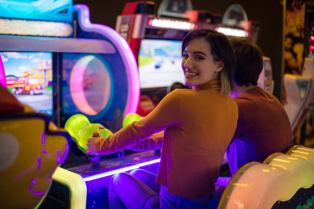 istock Couple having fun in playroom. Playing a games. 1306620739