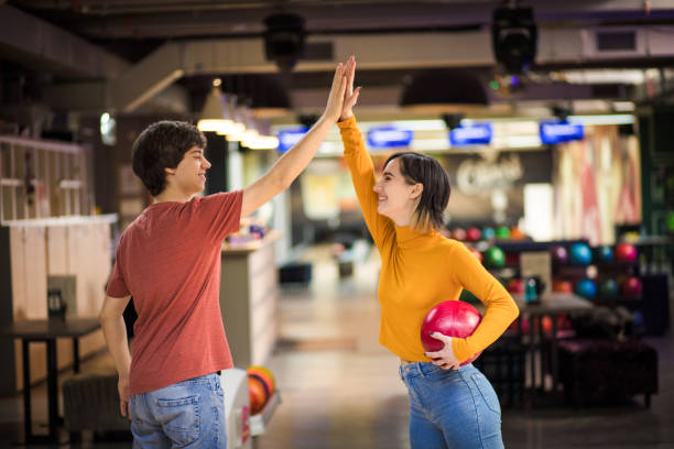 istock Young couple having fun in bowling alley. 1306620742