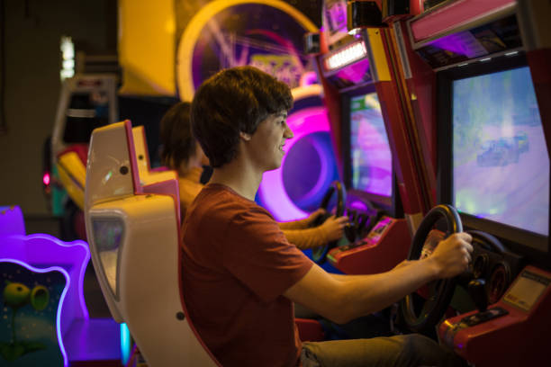 istock Couple having fun in playroom. Playing a games. Focus is on man. 1306620800