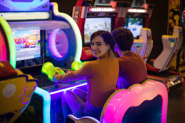 istock Couple having fun in playroom. Playing a games. 1306620815