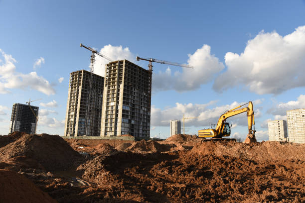 istock Excavator dig the trenches at a construction site. Trench for laying external sewer pipes. 1306621654