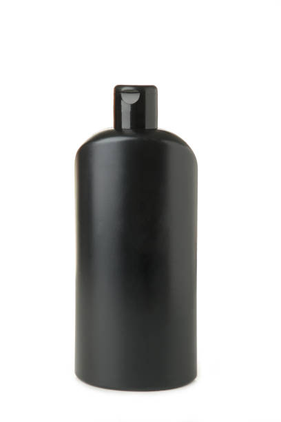 istock Black cosmetic container isolated on white background. Black shampoo bottle. 1306622639