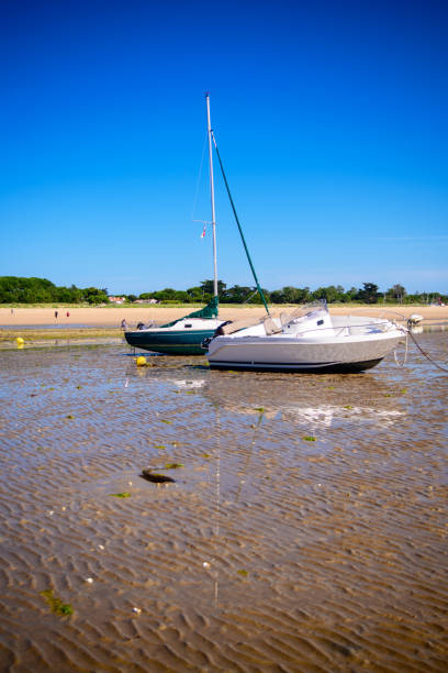 istock boats laying on the beach 1306624296