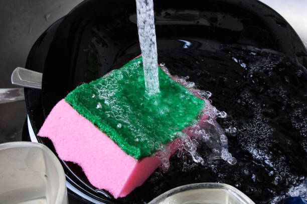 istock Dishes and sponge underwater in the sink 1306626312