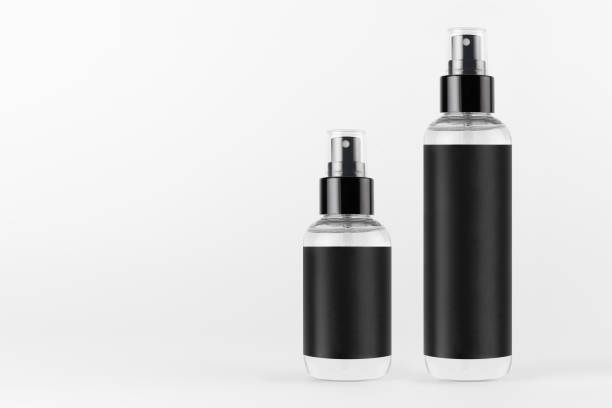 istock Tall, low transparent spray dispenser bottle for cosmetics with black label on white background, mock up for branding,  presentation, design. 1306626564