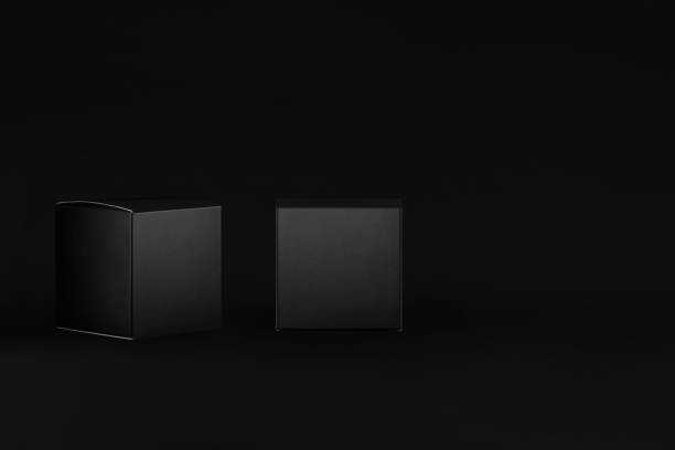 istock Luxury square black paper boxes side, front view on dark black background, mock up of packing, branding product, presentation, design, copy space. 1306626739