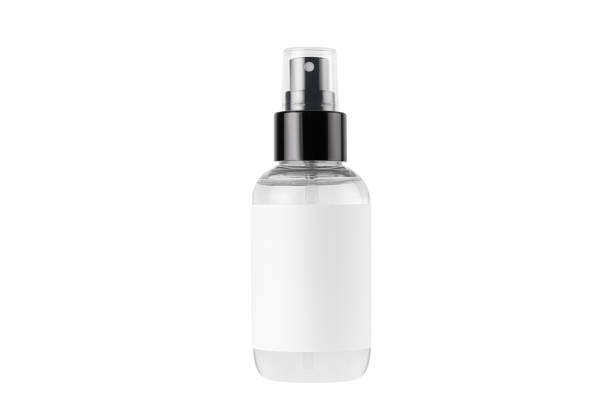istock Transparent spray bottle for cosmetics product with white blank label isolated on white background, mock up for branding, advertising, design. 1306626880