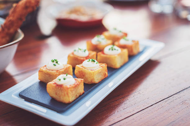 istock Spanish dish called Patatas Bravas served at a restaurant 1306629778