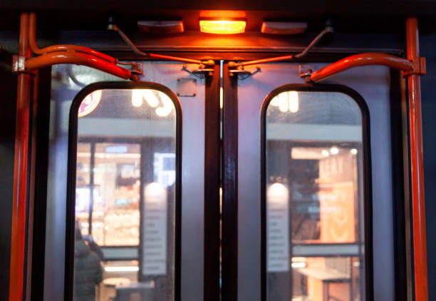 closed public transport doors with orange light signal