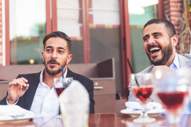 istock Friends cracking jokes on the dinner table and laughing loud 1306630056