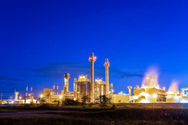 istock gas combine electric power plant with sunset 1306631476