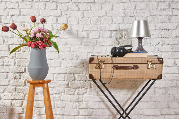 istock modern home living room white wall with wooden stool 1306631553