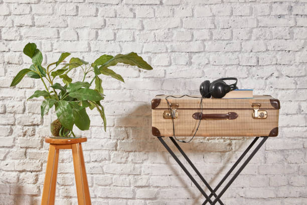 istock modern home living room white wall with wooden stool 1306631585