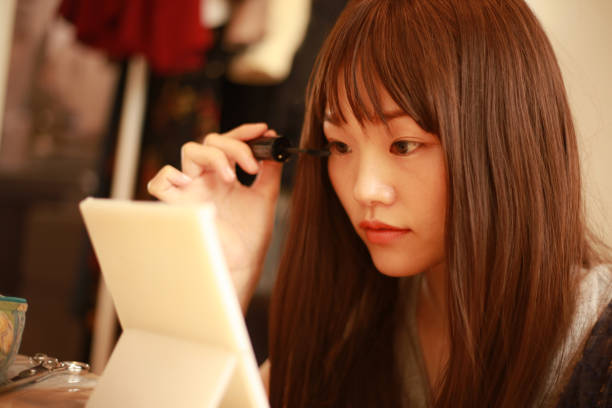 Teen looking at herself in mirror