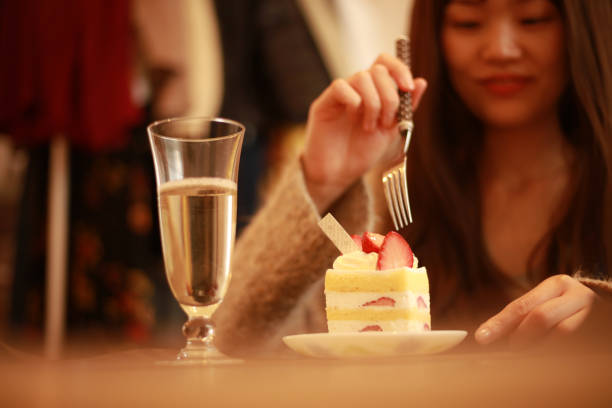 istock Woman eating cake 1306635372