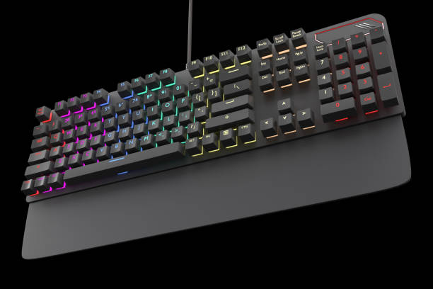 istock Black computer keyboard with rgb color isolated on black with clipping path. 1306638321