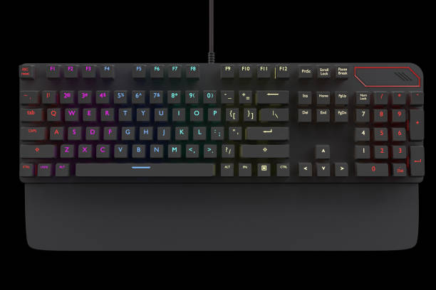 istock Black computer keyboard with rgb color isolated on black with clipping path. 1306638344