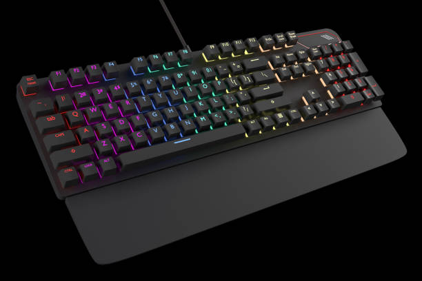 istock Black computer keyboard with rgb color isolated on black with clipping path. 1306638368