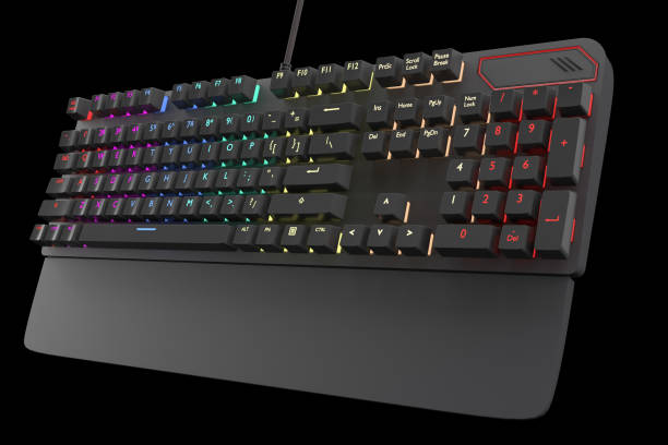 istock Black computer keyboard with rgb color isolated on black with clipping path. 1306638412
