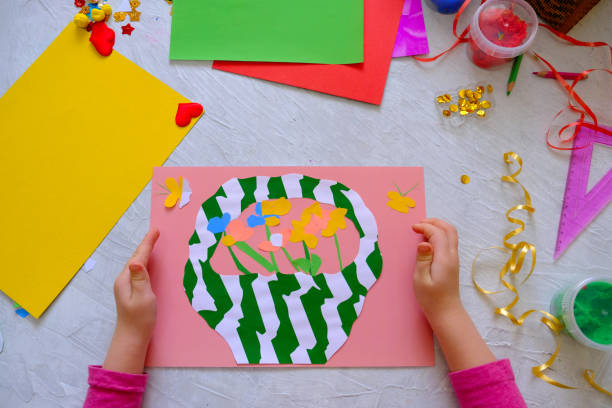 istock Child making homemade greeting card. 1306639447