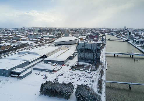 An aerial view of the River Clyde in the snow. View shows the SEC Campus, Hydro, Armadillo.