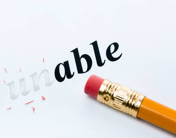 istock Word  unable  and pencil with eraser close-up 1306642231