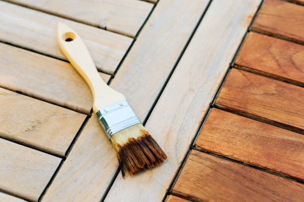 istock paintbrush on a renewable exotic wooden garden table - for background 1306642253