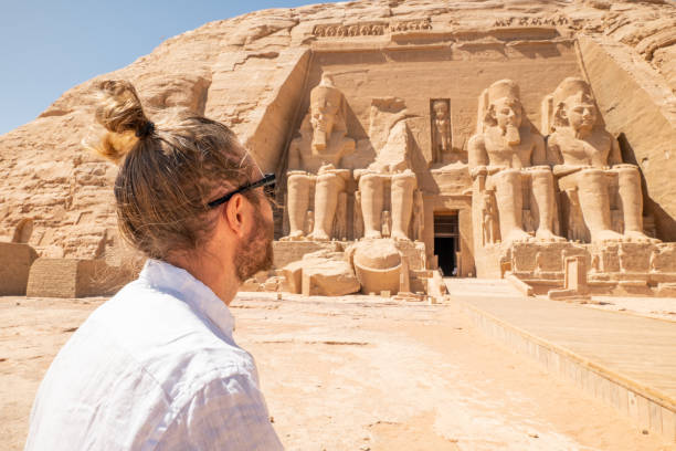 istock Man contemplates Abu Simbel temple in Egypt 1306646158