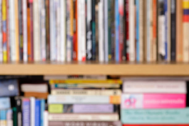 Defocused shelves with books, colorful background