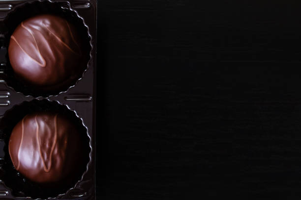 istock Chocolate candies in a box closeup, copy space 1306650552