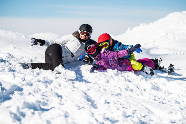 istock Happy mother on ski vacation with her children 1306651507
