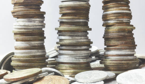 istock Towers made of diverse old coins, selective focus. 1306654303
