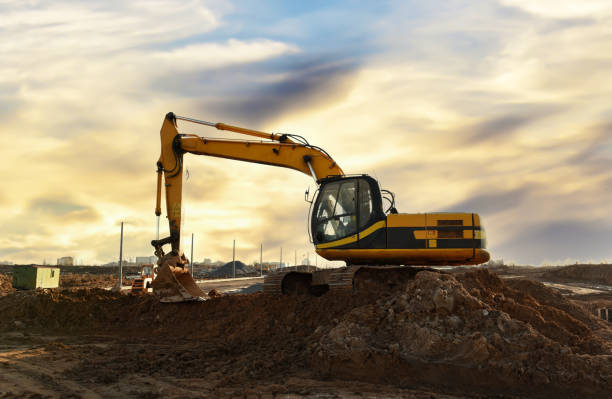 istock Excavator dig the trenches at a construction site. Trench for laying external sewer pipes. 1306655921